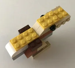 10696 Tan dinosaur