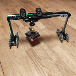 Small crane with Wheels and a bucket