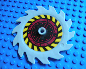 Lego Technic Circular Saw Blade 9 x 9 with Pin Hole and Teeth in Same Direction with Black and Yellow Stripes and Dark Red Pattern (Sticker) - Set 8113